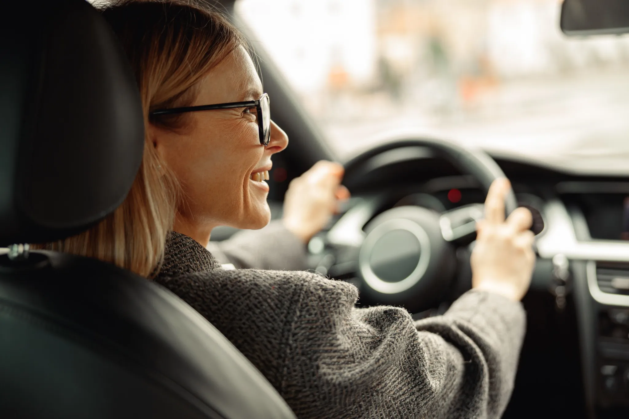 woman driving rental car