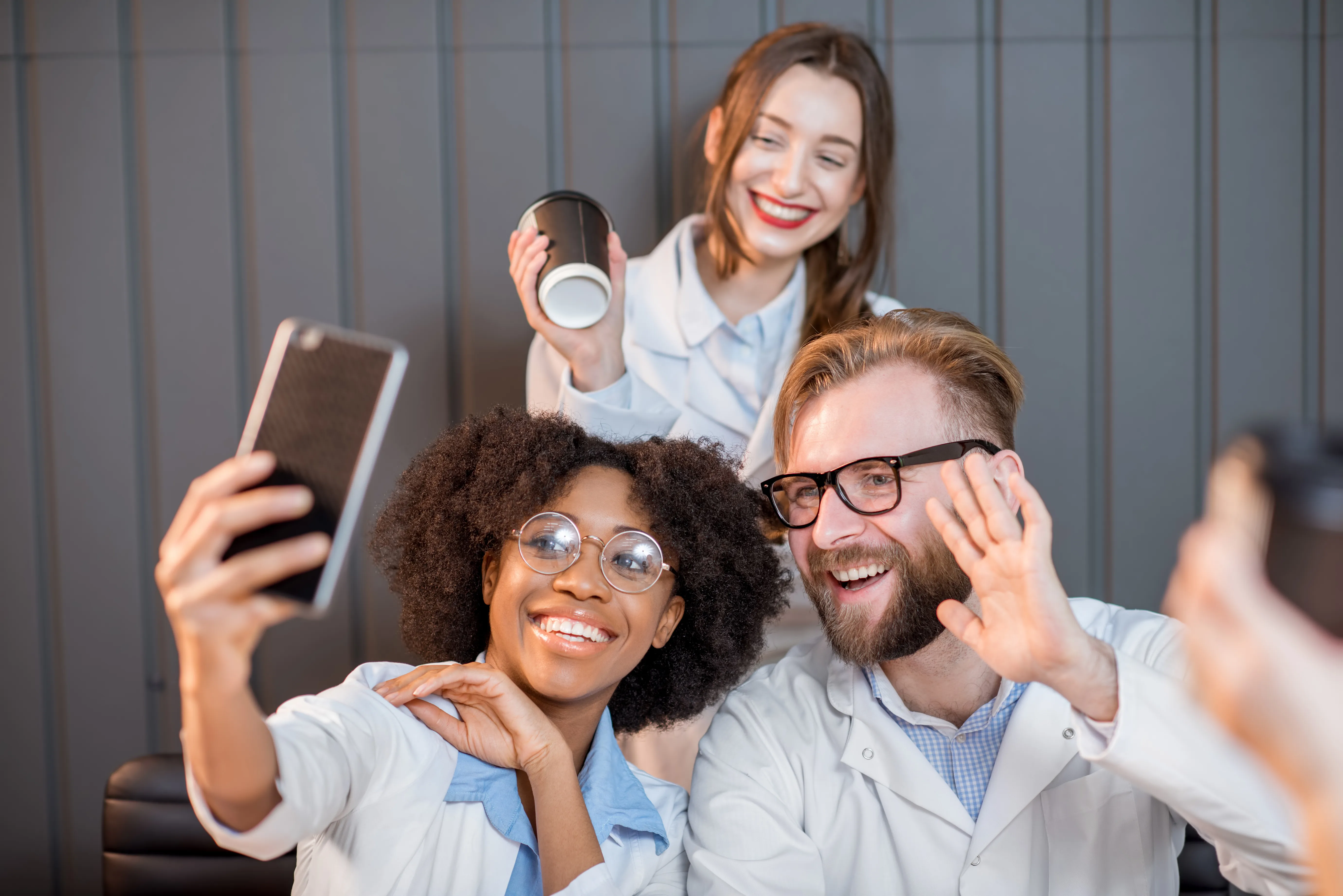 Medical lab interns smiling taking a selfie