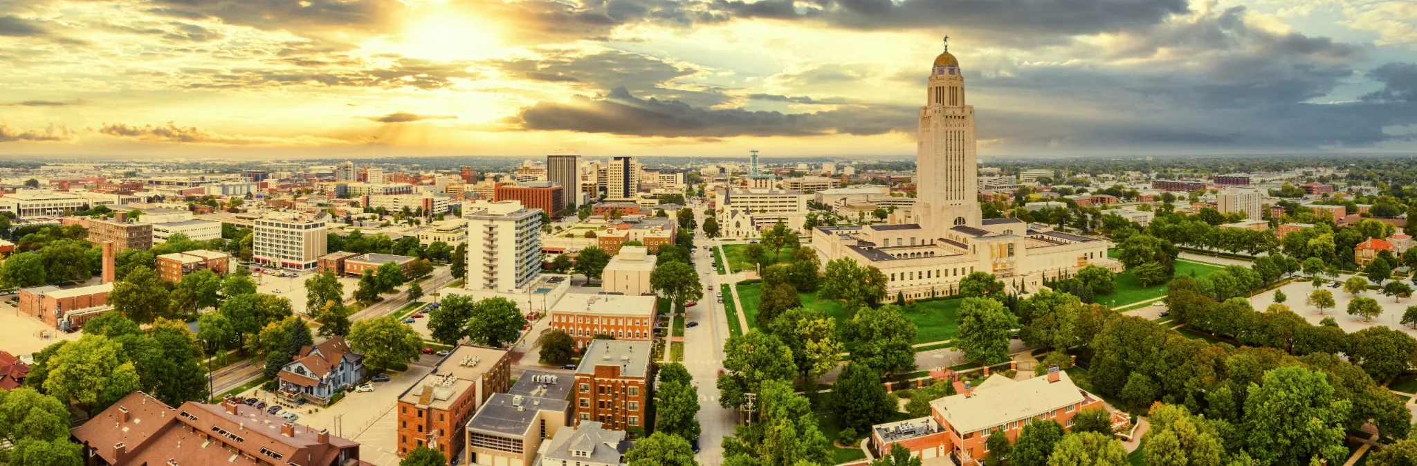 Aerial panorama of Lincoln, Nebraska under a dramatic sunset. Lincoln is the capital city of the U.S. state of Nebraska and the county seat of Lancaster