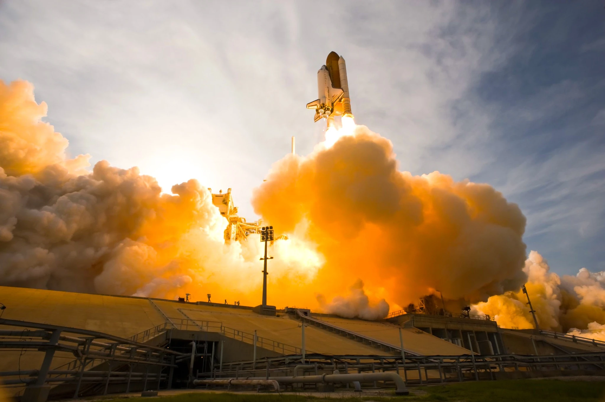 Rocket laughing into space from Cape Canaveral, FL. Spacecraft launch. Smoke and steam shown. The elements of this image furnished by NASA..