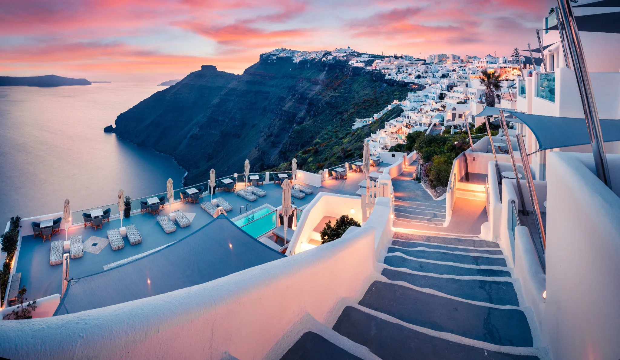 Great evening view of Santorini island. Picturesque spring sunset on the famous Greek resort Fira, Greece, Europe. 
