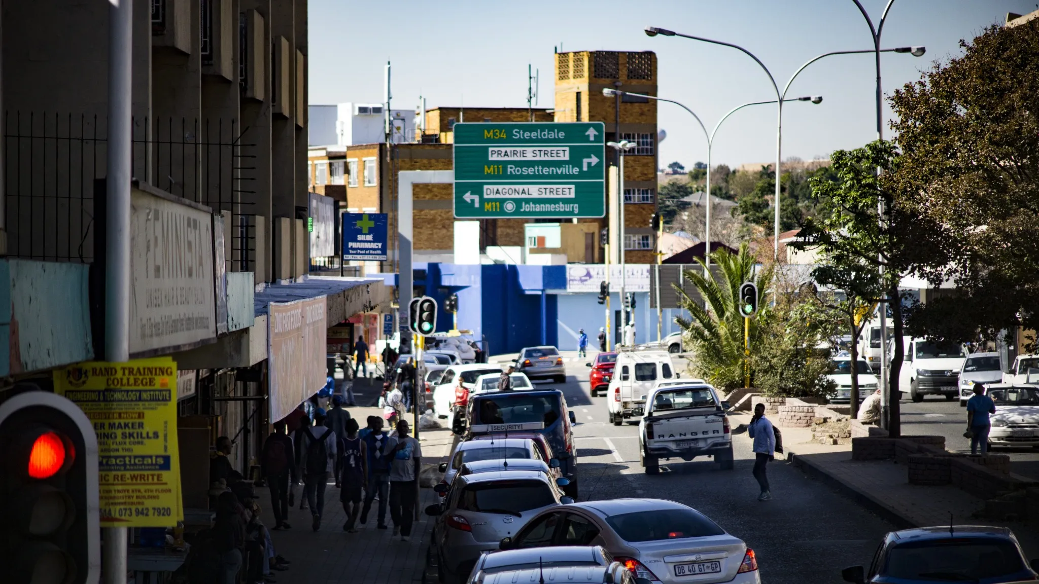 Urban city view with cars, street, people, Johannesburg, South Africa.
