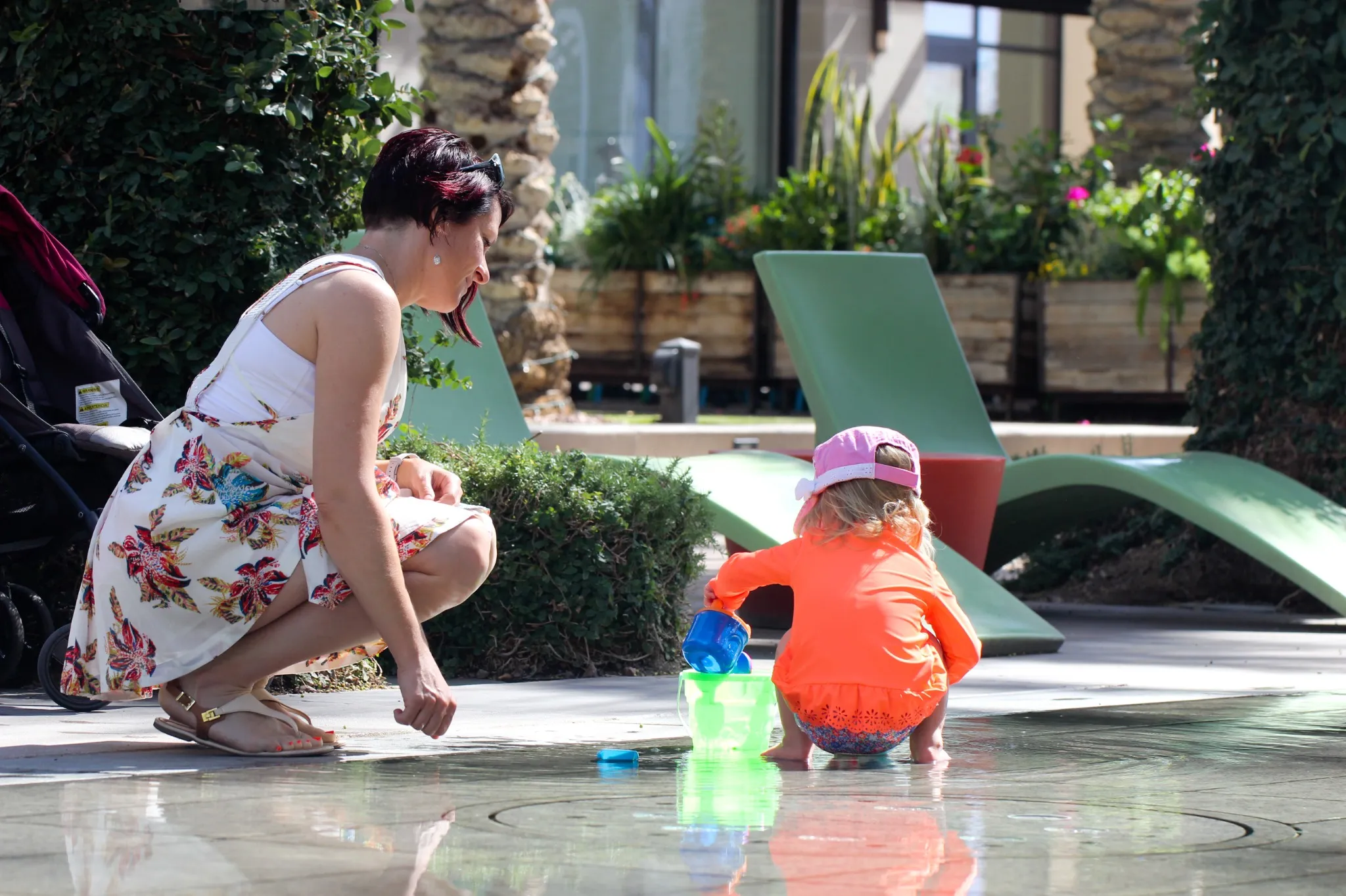Close up Portrait of Beautiful Mother and 2 Years Old Blonde Toddler Girl in Pink Summer Hat, mother playing with baby Girl, Happy Family Concept, Having Fun in Scottsdale Arizona USA.