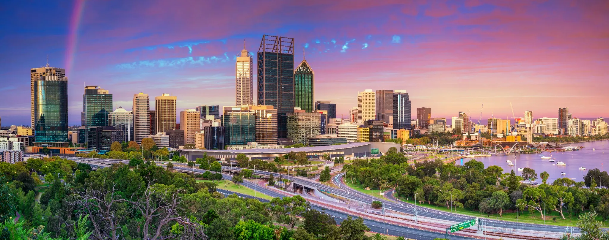 Panoramic cityscape image of Perth skyline, Australia during dramatic sunset..