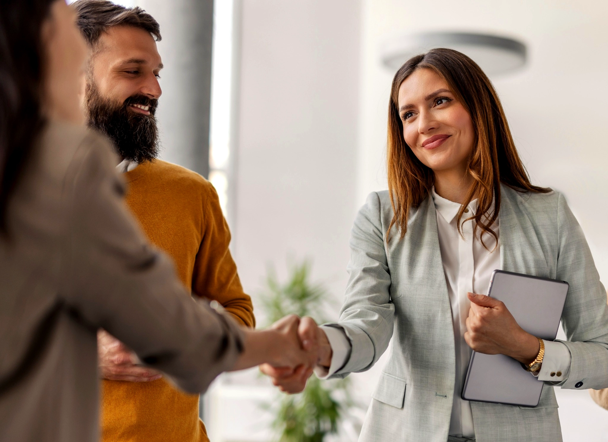 Kind women shaking hands with teammates