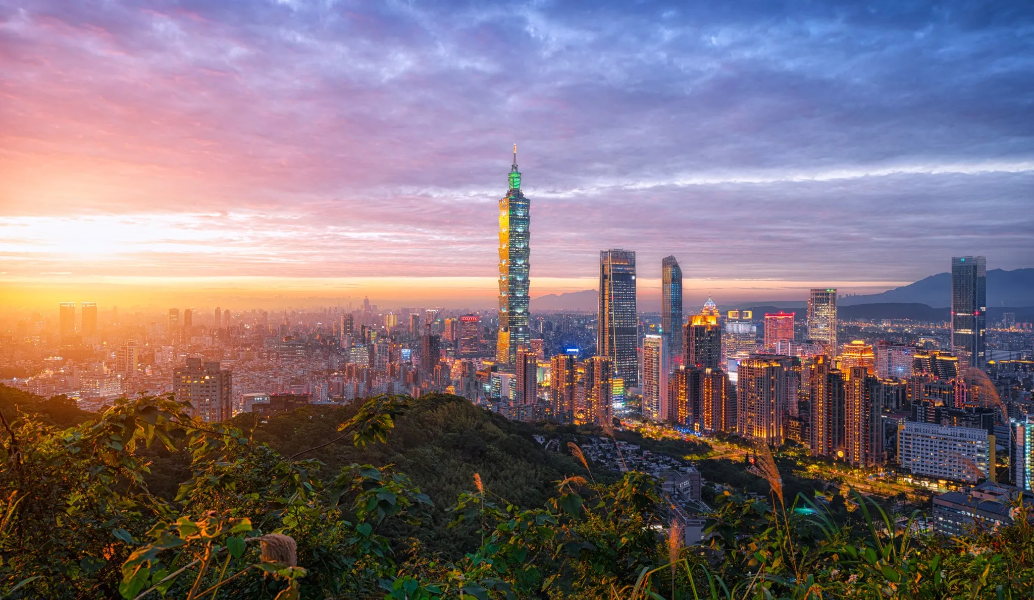 Taipei skyline panorama with view of Taipei 101 beautiful Taipei sunset, Taiwan city business skyline and skyscrapers, skyscrapers and other modern buildings of the city.