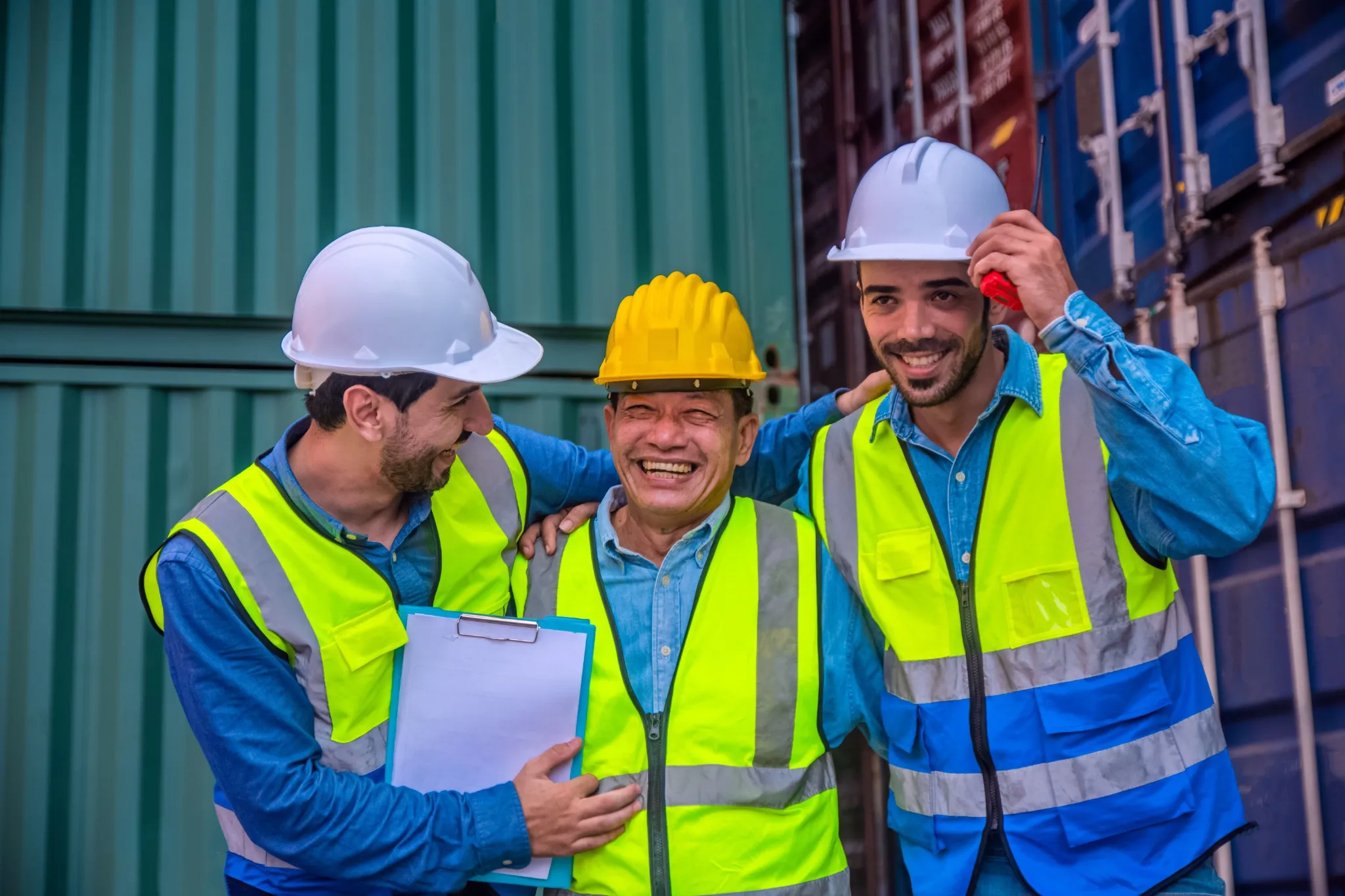 Team Businessman working on site containers yard for business shipping import and export, Caucasian worker inspecting container in warehouse logistic delivery services, export management team.