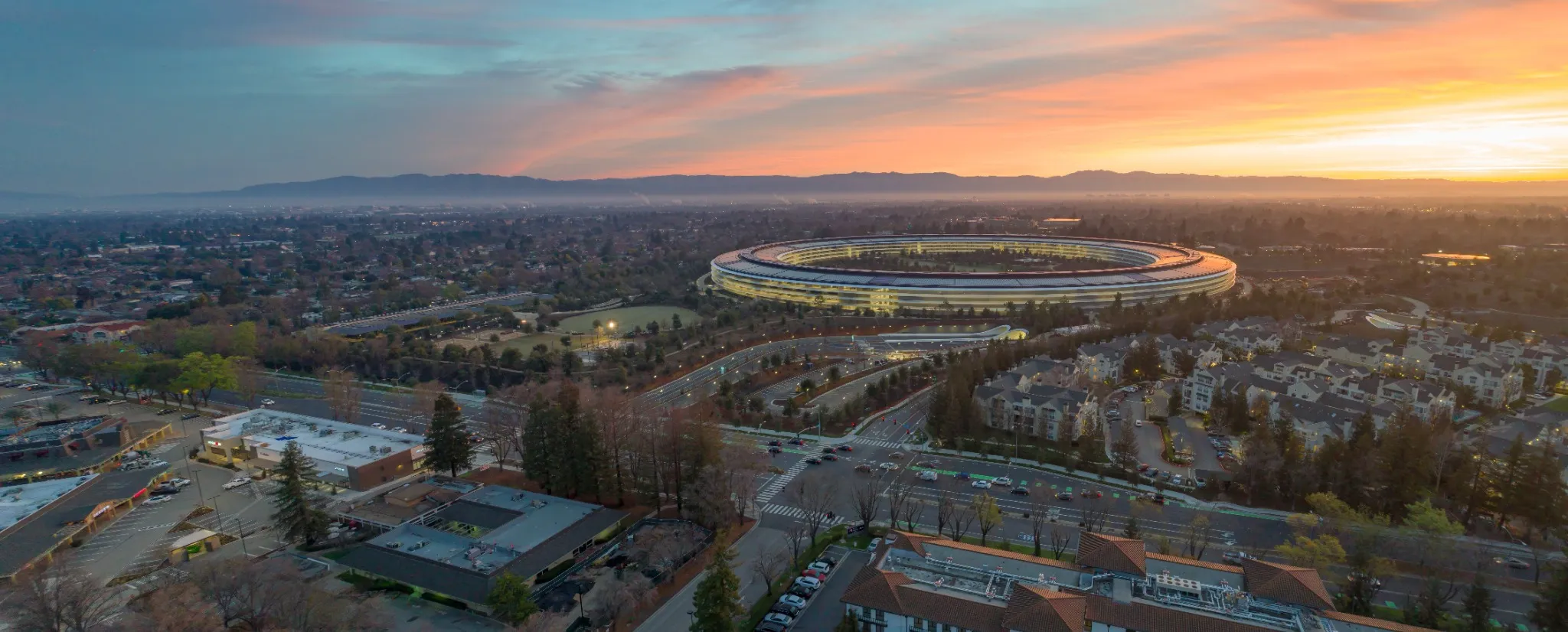 Aerial view of Apple Park headquarters at sunrise in Cupertino, California, USA.