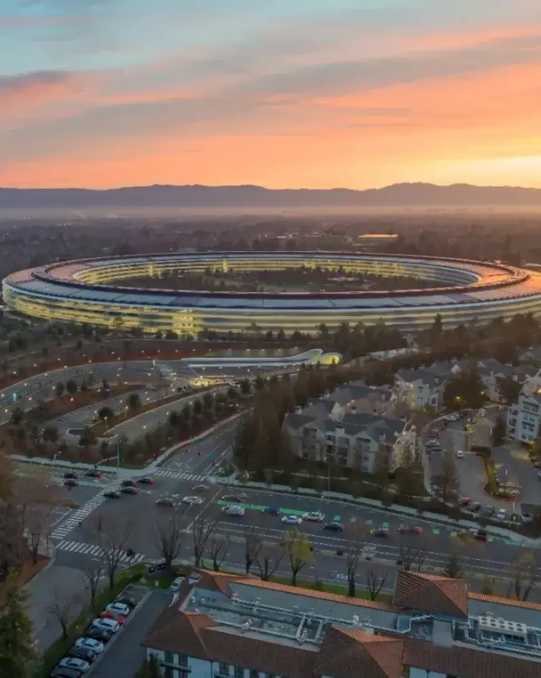 Aerial view of Apple Park headquarters at sunrise in Cupertino, California, USA.