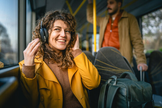 Woman happy on public transport
